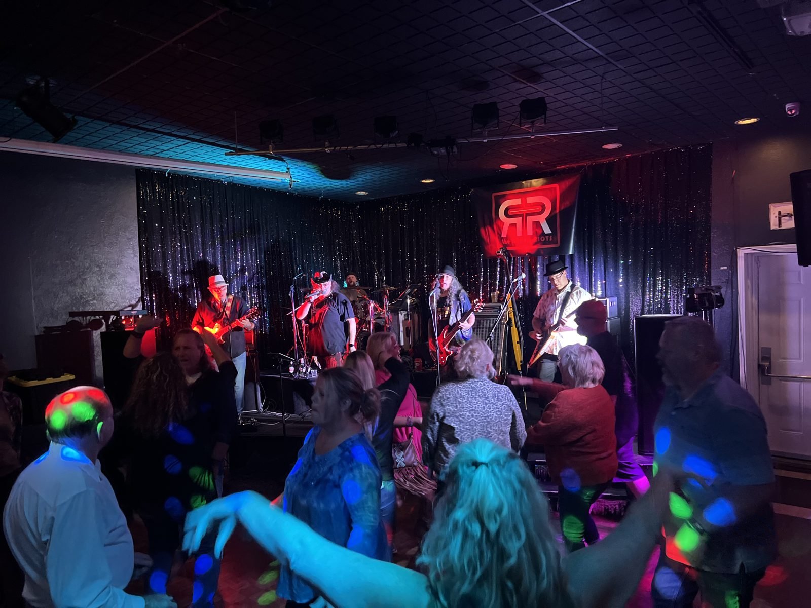 A live band playing to a packed dance floor at M&M Restaurant & Lounge in Gresham
