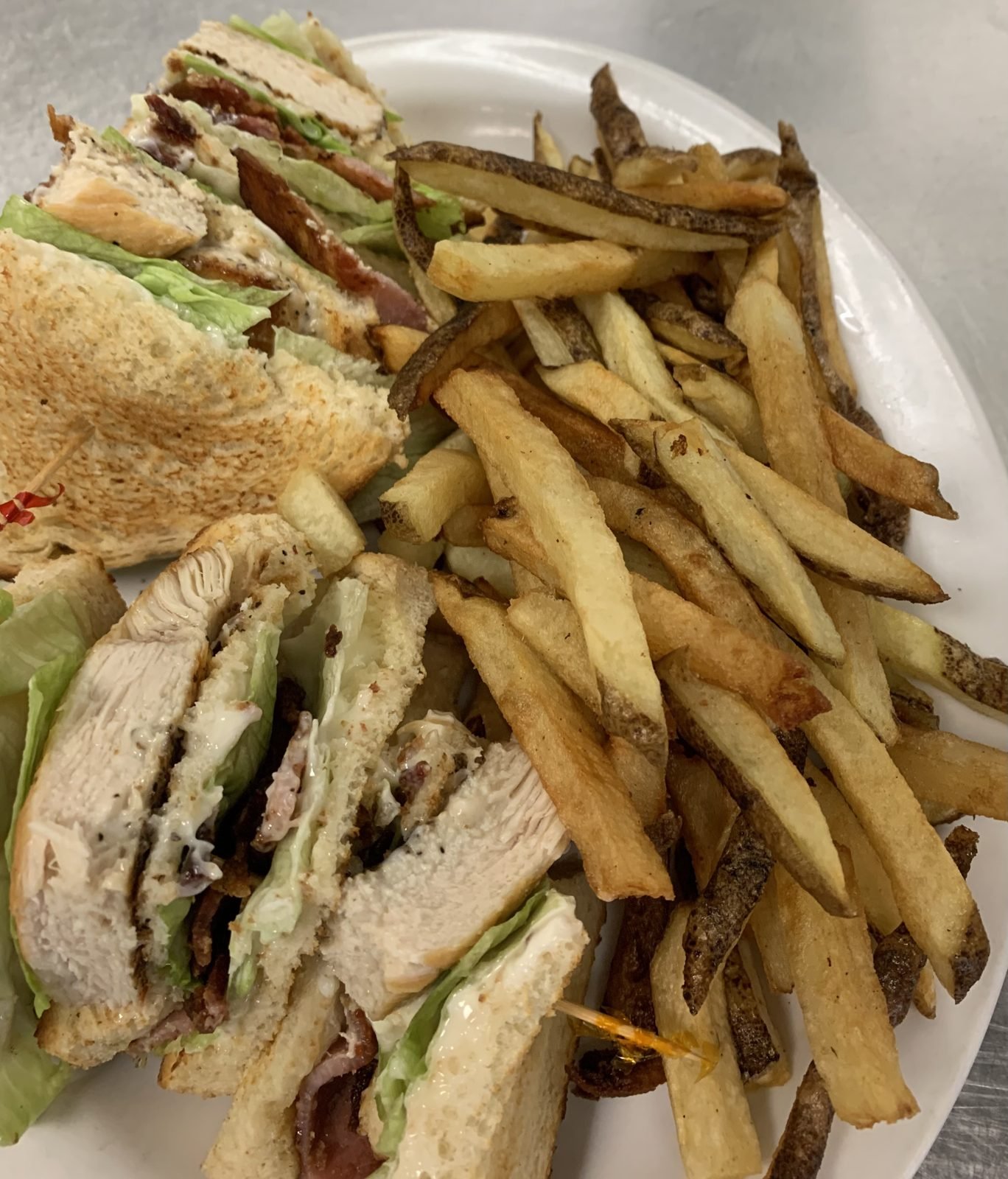 Clubhouse sandwich with fries